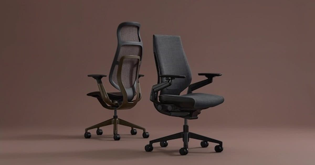 Two adjustable task chairs on casters against a warm brown background.