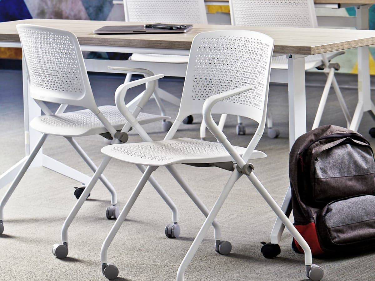 White SitOnIt Qwiz nesting chairs at training tables