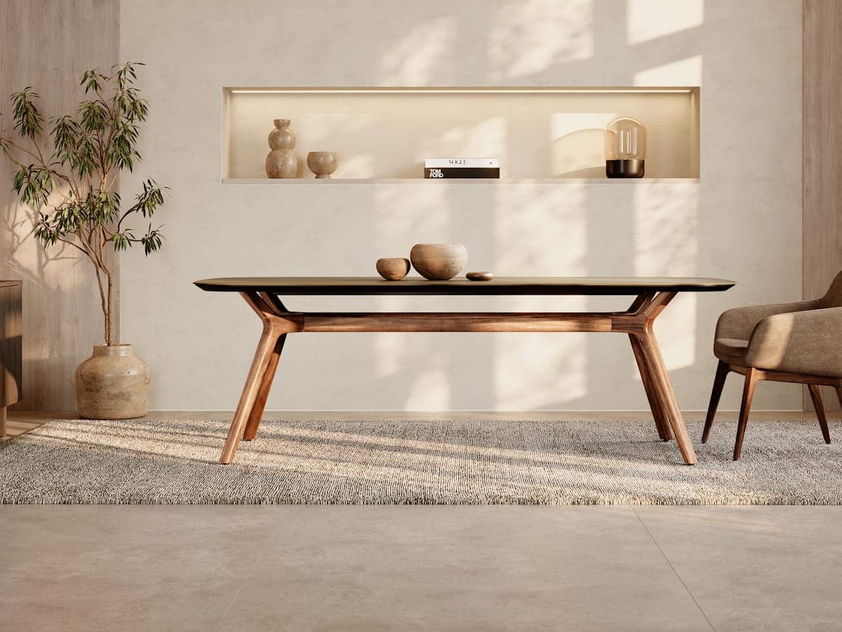 Walnut JSI Anthology trestle table with a lit wall niche