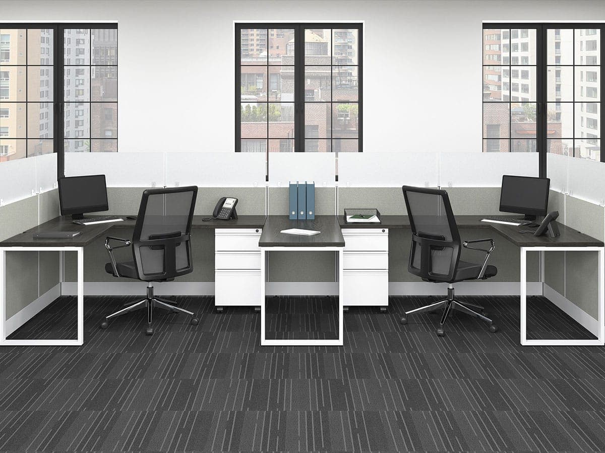 Two-person run of SIS workstations with dark worksurfaces and white loop legs