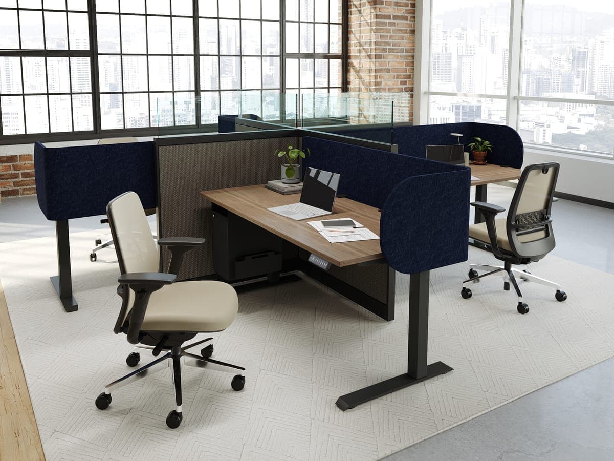 AMQ Tektis sit-stand workstations with navy felt screens in a brick loft office