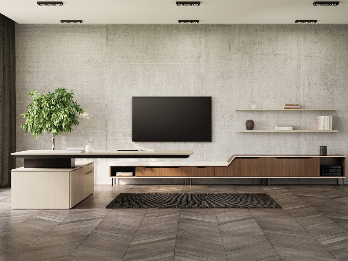 JSI Vision cantilevered desk with a long walnut credenza against a concrete wall