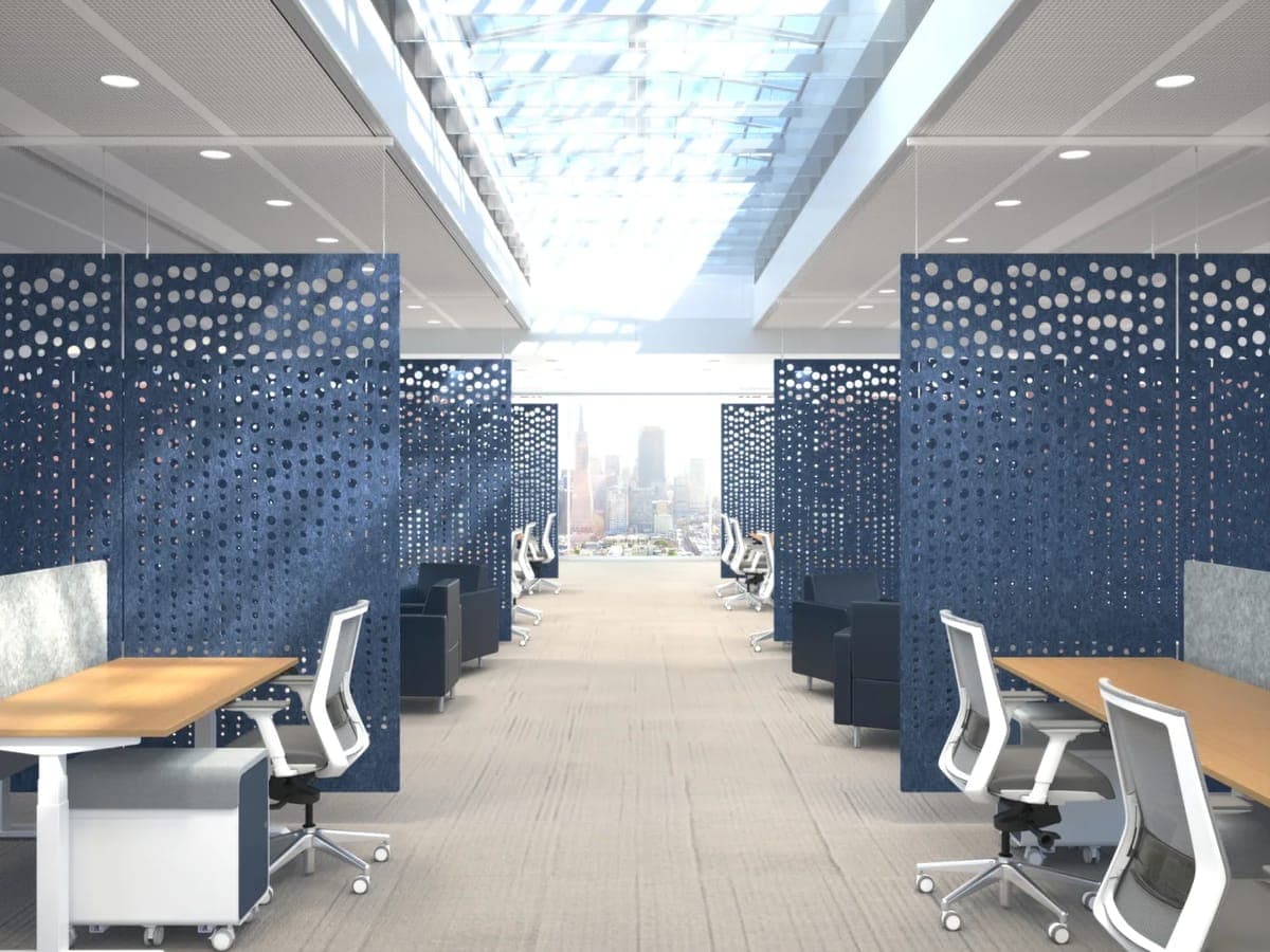 Navy perforated AMQ 3F hanging panels lining an office aisle