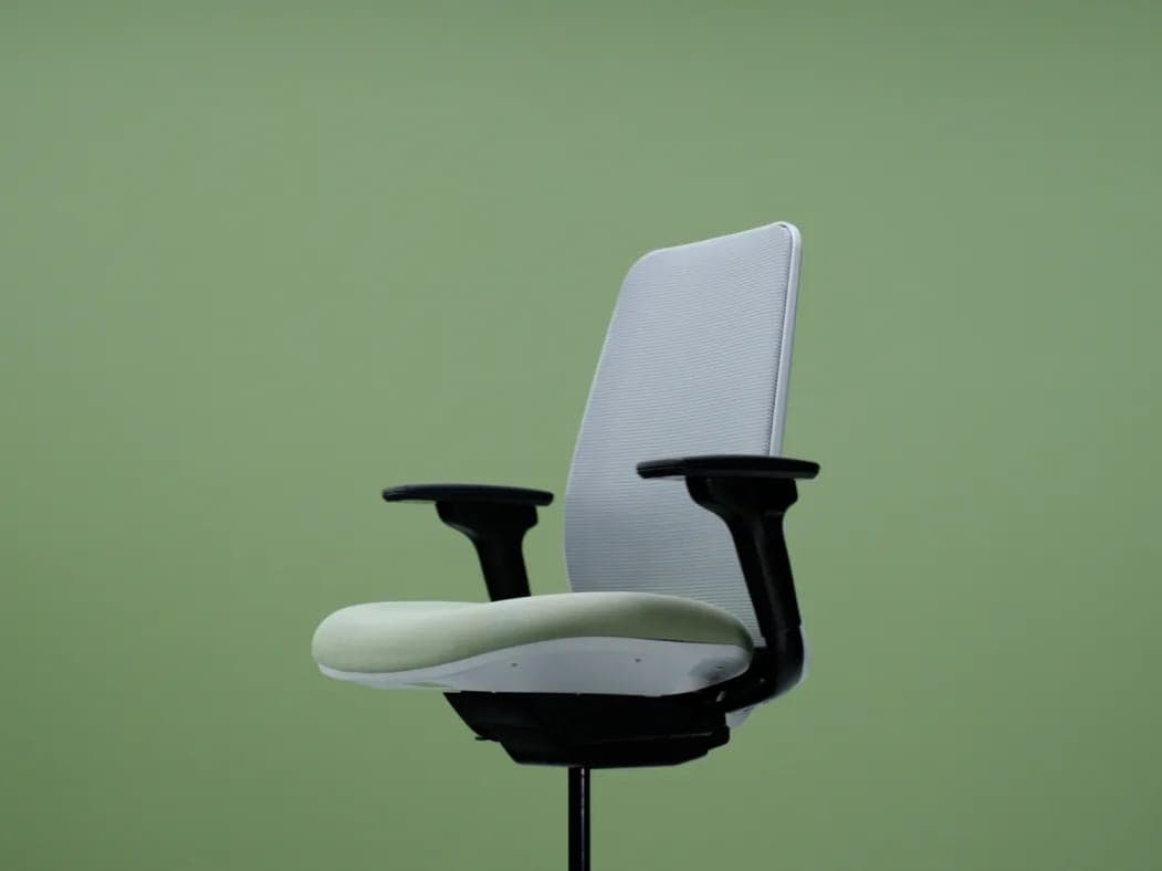 AMQ Personality Plus task chair with a light gray mesh back