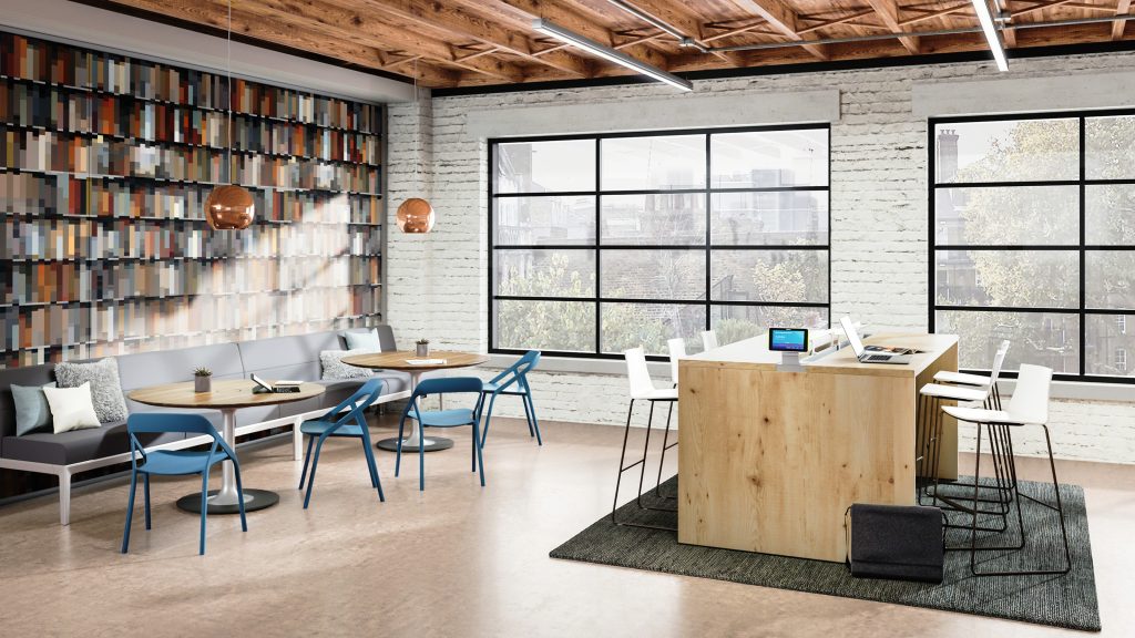 A bright multipurpose workspace with two large windows and light floors.